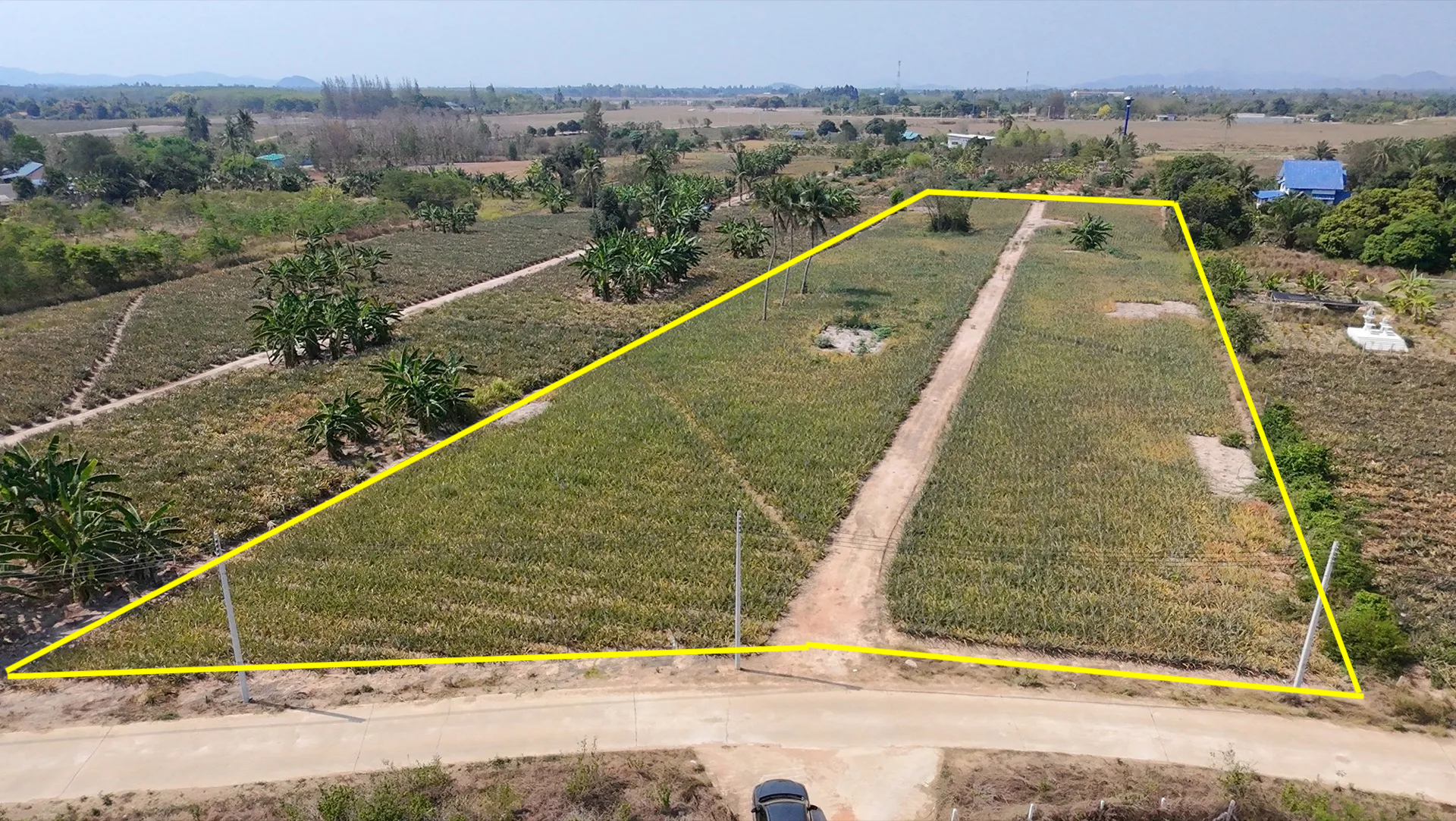 Aerial drone view of 6-Rai development land for sale in Hua Hin with clear boundaries highlighted